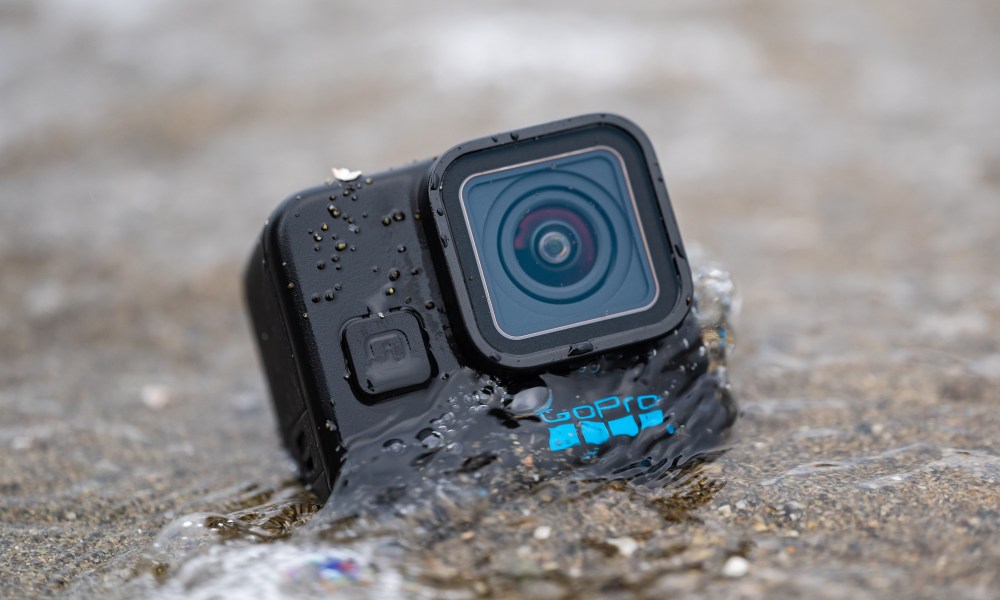 The GoPro Hero 11 Mini getting hit by a wave.