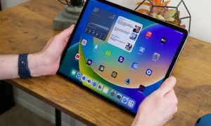 Someone holding the 12.9-inch version of the iPad Pro (2022).