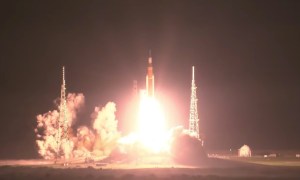 NASA's SLS rocket launching at the start of the Artemis I mission.