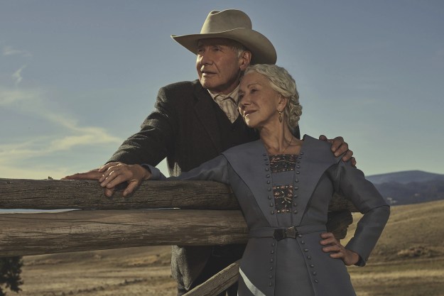 Harrison Ford and Helen Mirren lean against a fence together in 1923.