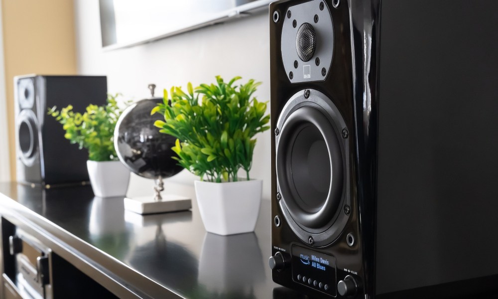 SVS Prime Wireless Pro speaker on entertainment stand in living room.