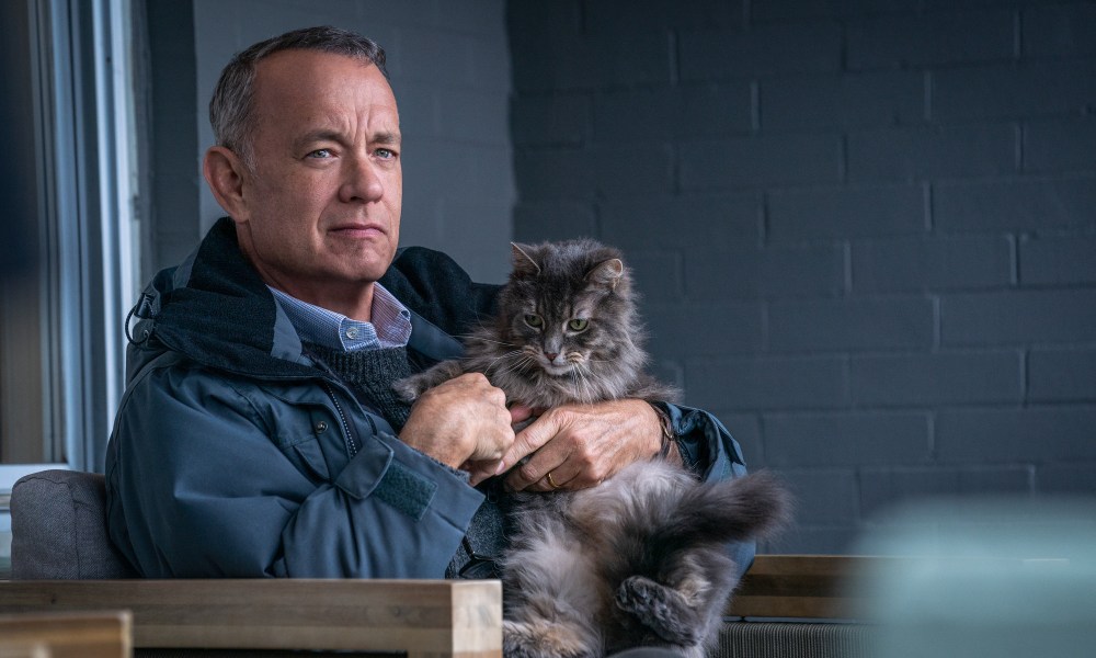 Tom Hanks holds a cat in A Man Called Otto.