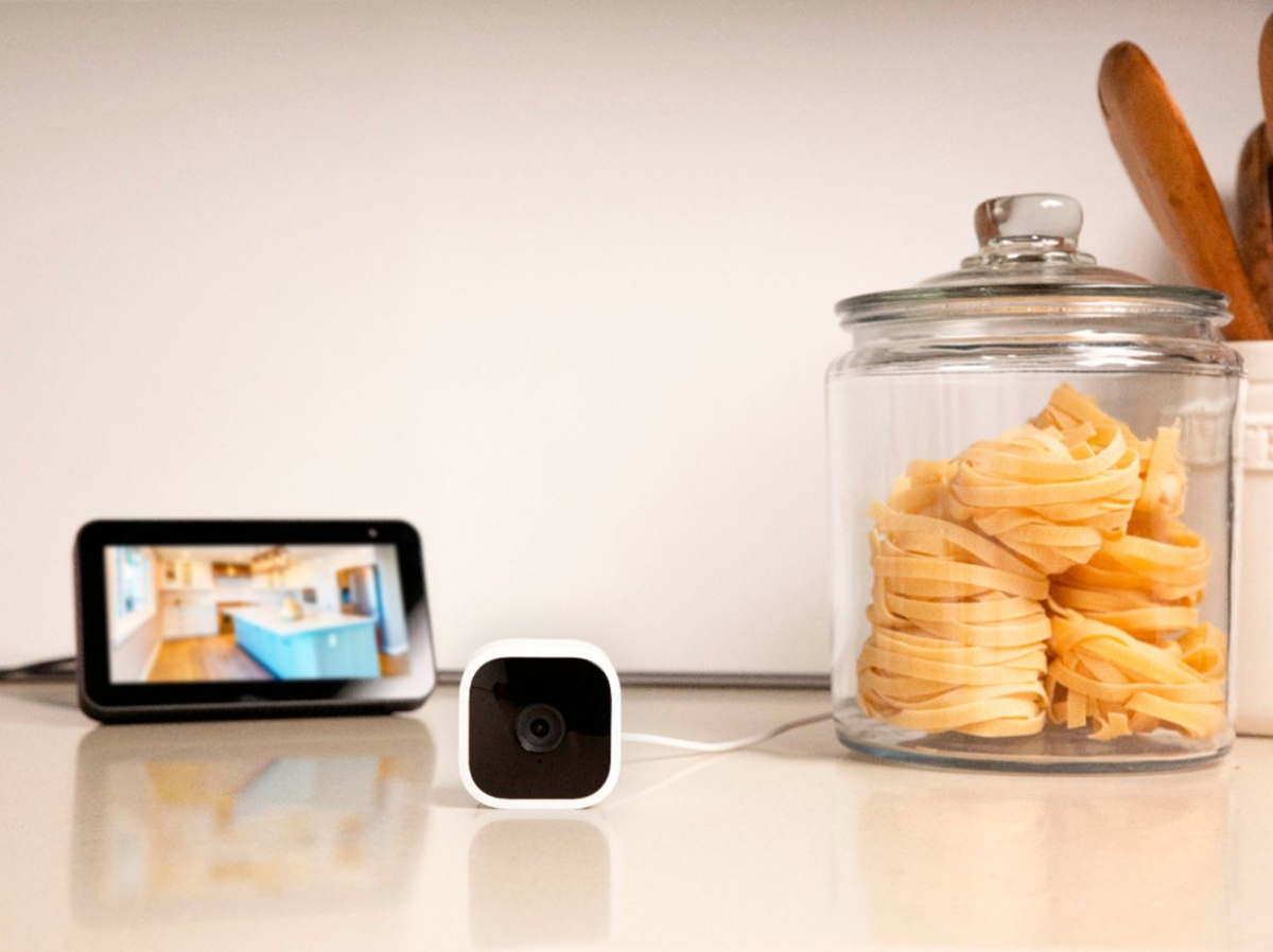 best blink camera deals mini indoor 1080p wireless security on a counter showing video capture an echo show display