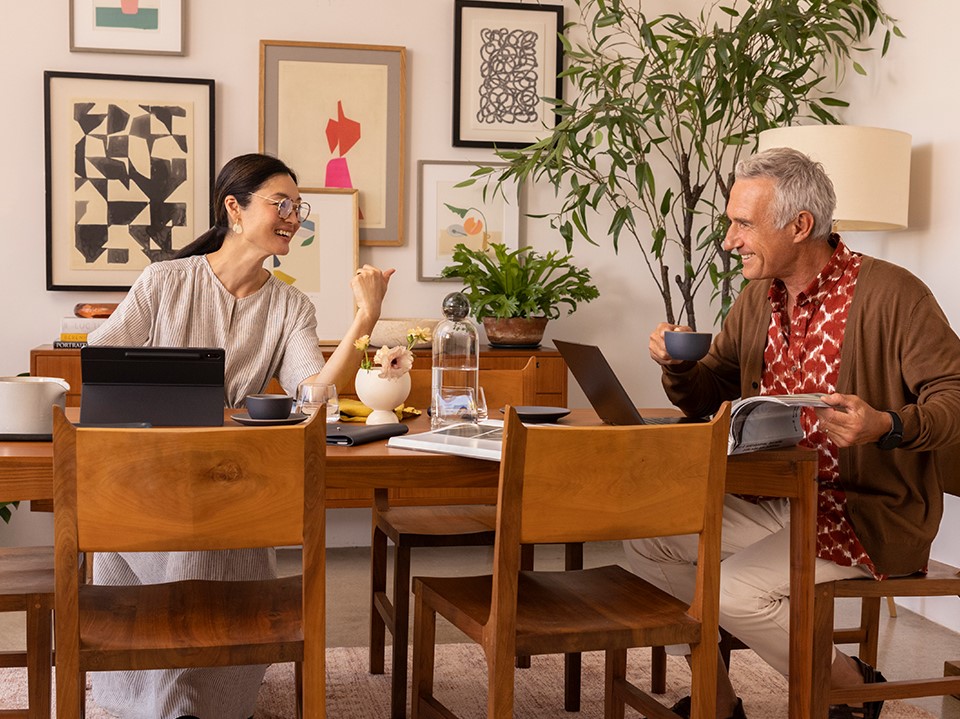 Family using internet in the dining room