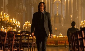 Keanu Reeves as John Wick stands in a church in "John Wick: Chapter 4."