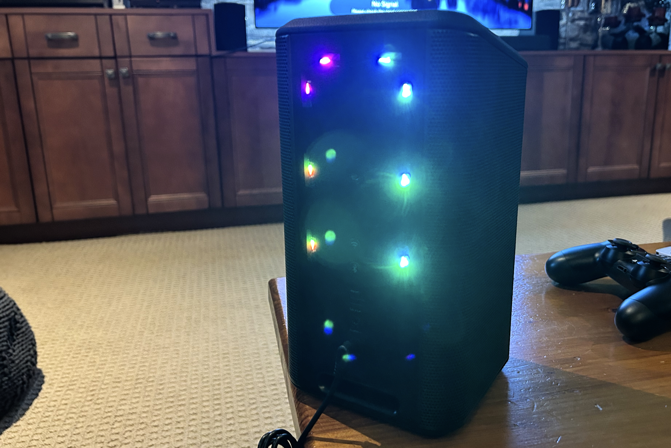 Philips Fidelio FS1 wireless speaker rear panel, LED lights on.