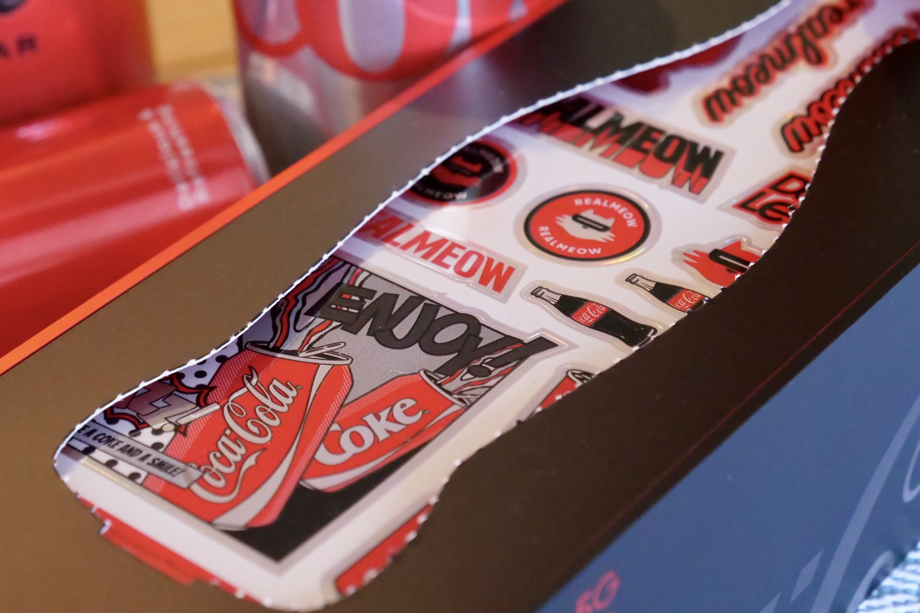 The stickers inside the box of the Realme X Coca-Cola phone.