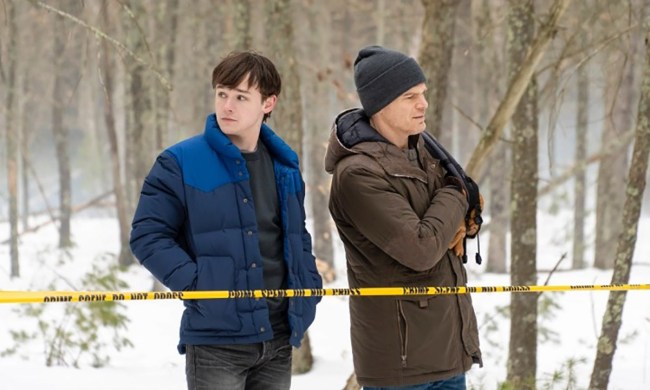 Dexter and his son Harrison standing out in the snow by caution tape in a scene from Dexter: New Blood.