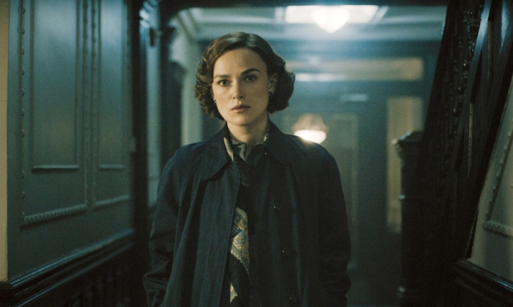 A woman stands in a hallway in Boston Strangler.