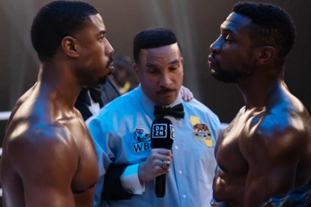 Michael B. Jordan and Jonathan Majors face each other in a boxing ring in Creed 3.