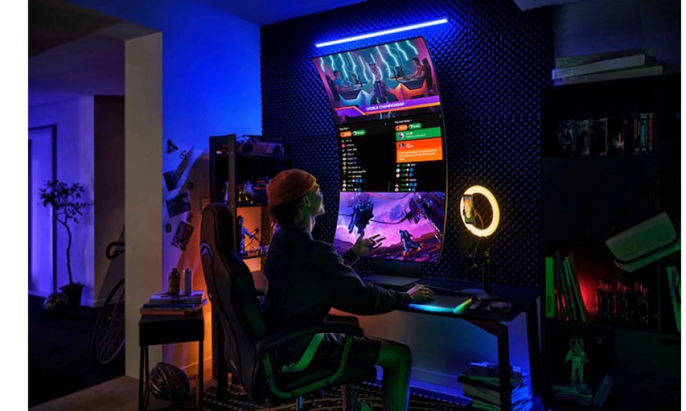 Someone using the Samsung 55-inch Odyssey Ark 4K Curved Gaming Monitor in a gaming aesthetic environment.