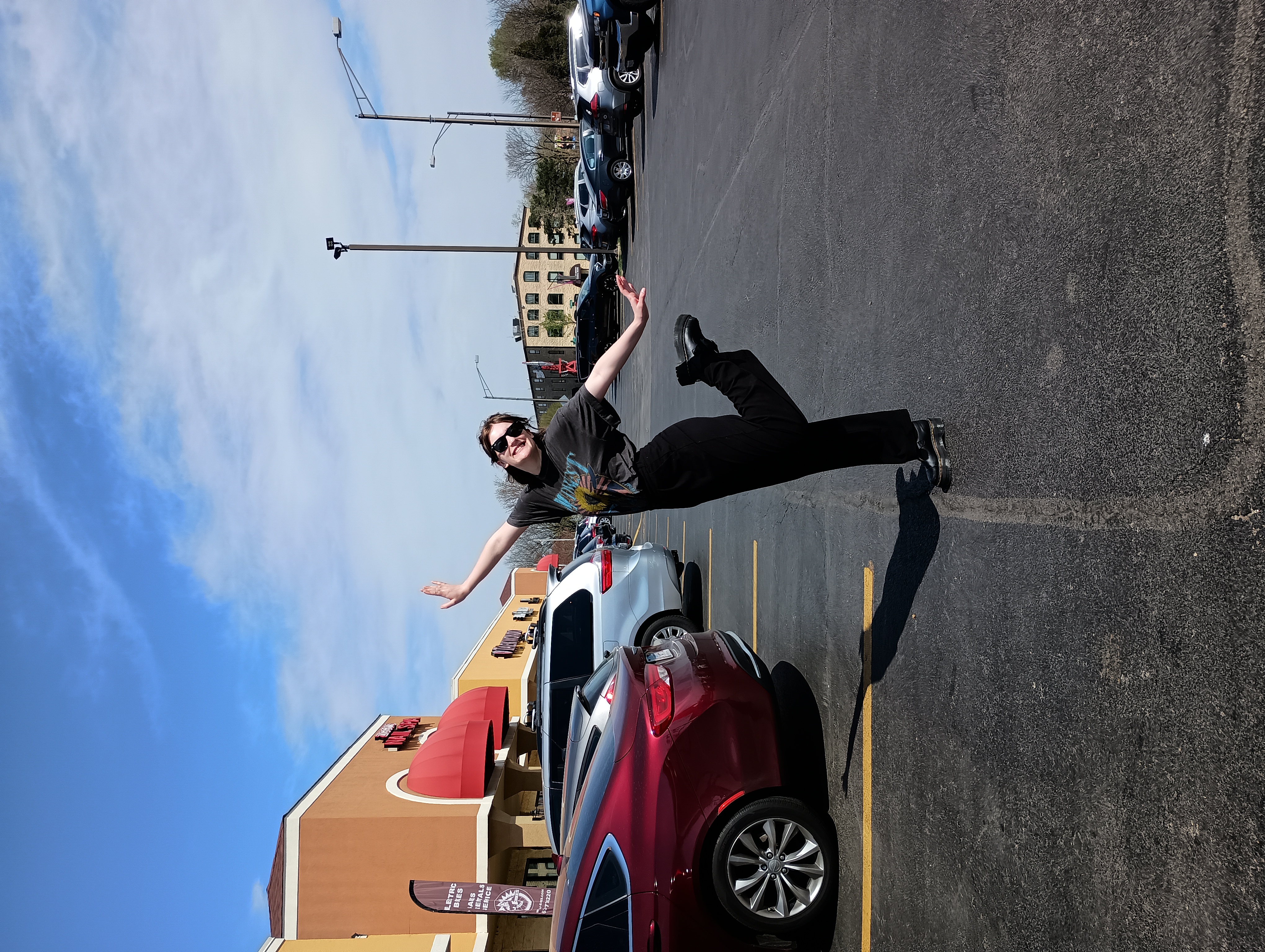 A photo taken of a woman posing in a parking lot using the Moto G Power 5G's rear camera.