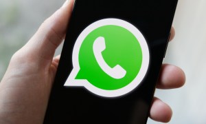 WhatsApp logo on a phone.