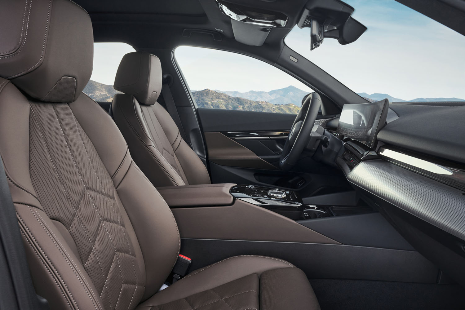 The front seats and interior of a 2024 BMW i5.