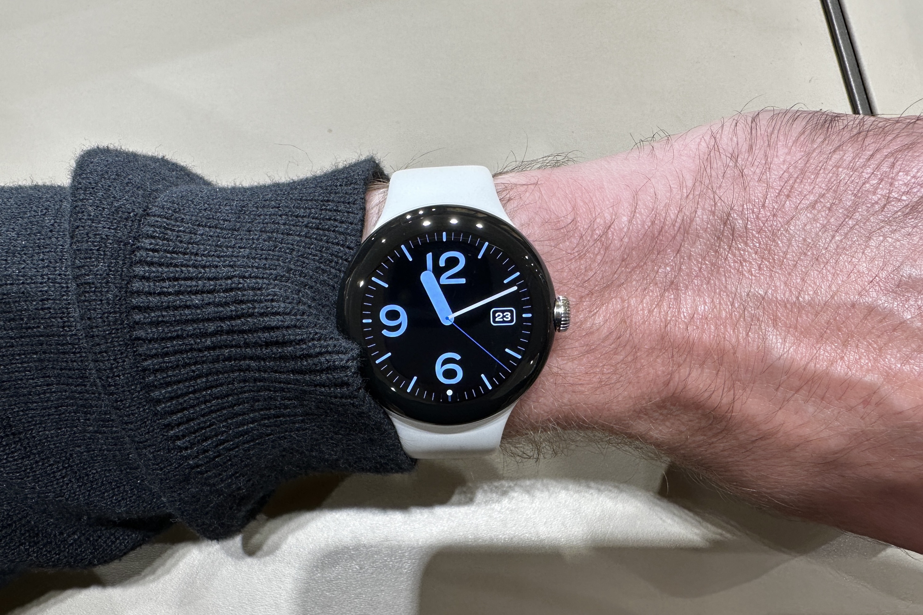 The Pixel Watch on a person's wrist.