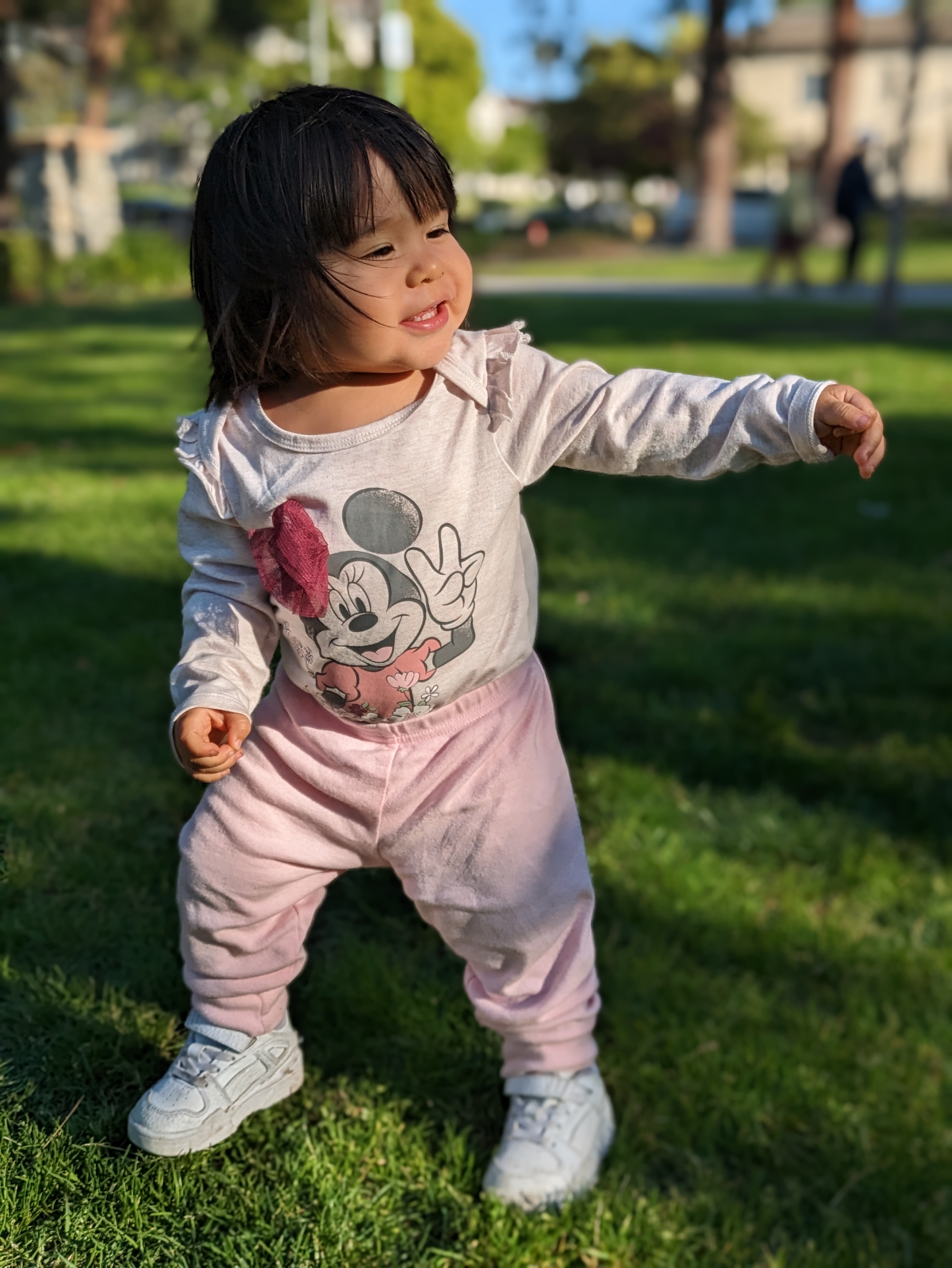 Portrait mode shot of toddler spinning taken with Google Pixel 7a