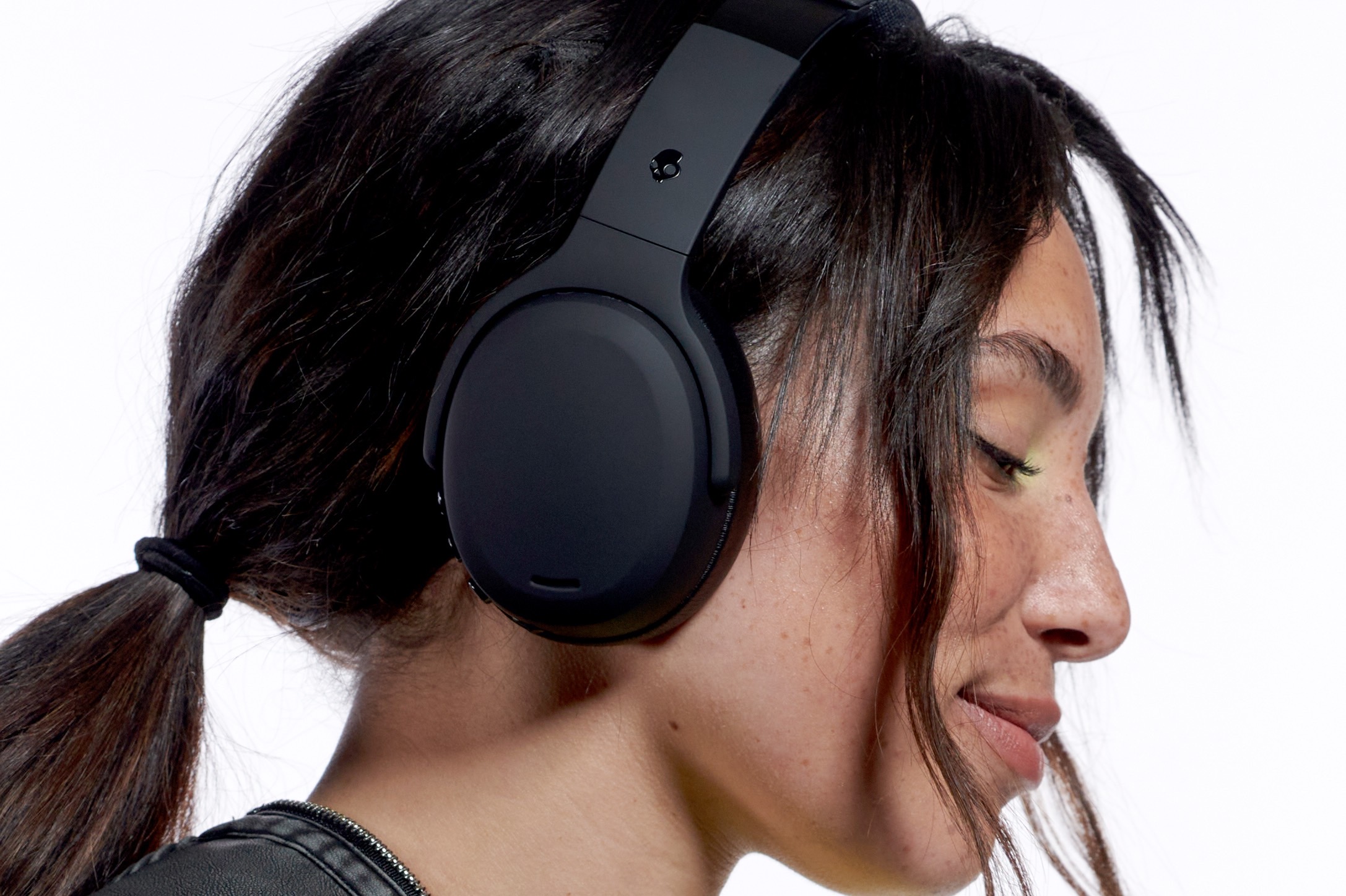 Woman wearing Skullcandy Crusher ANC 2.