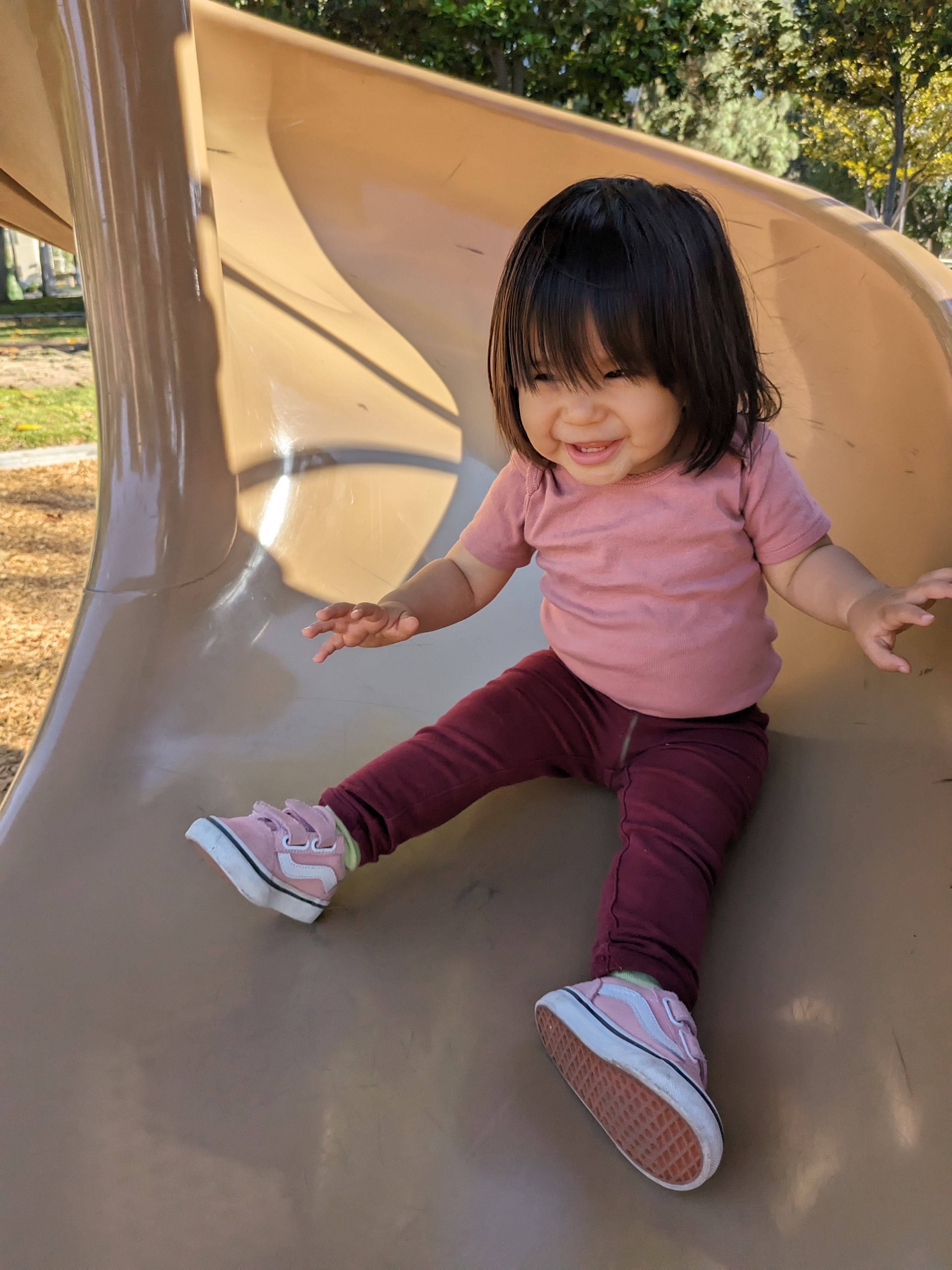 Toddler daughter going down slide taken with Google Pixel Fold.