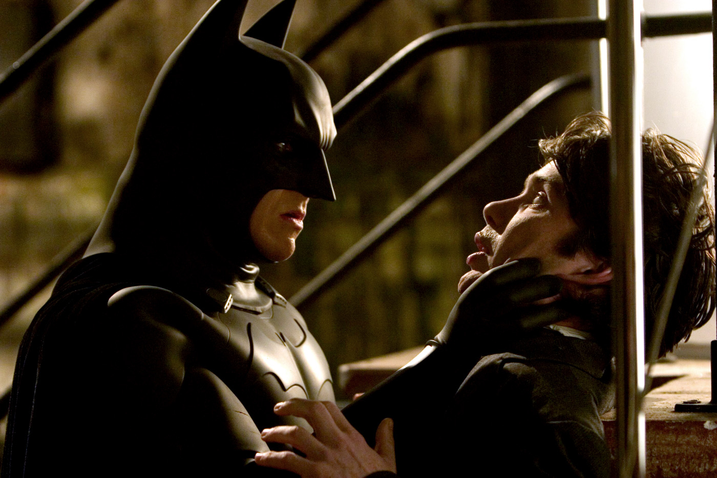 Batman fights a man in Batman Begins.