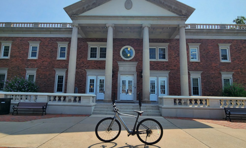 Velotric T1 parked in front of a Federal style New England town hall