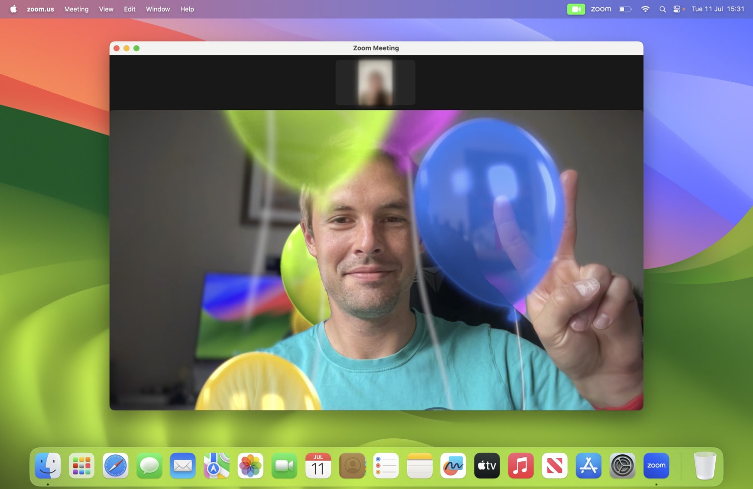 Video reactions in macOS Sonoma, with the balloons effect in use.