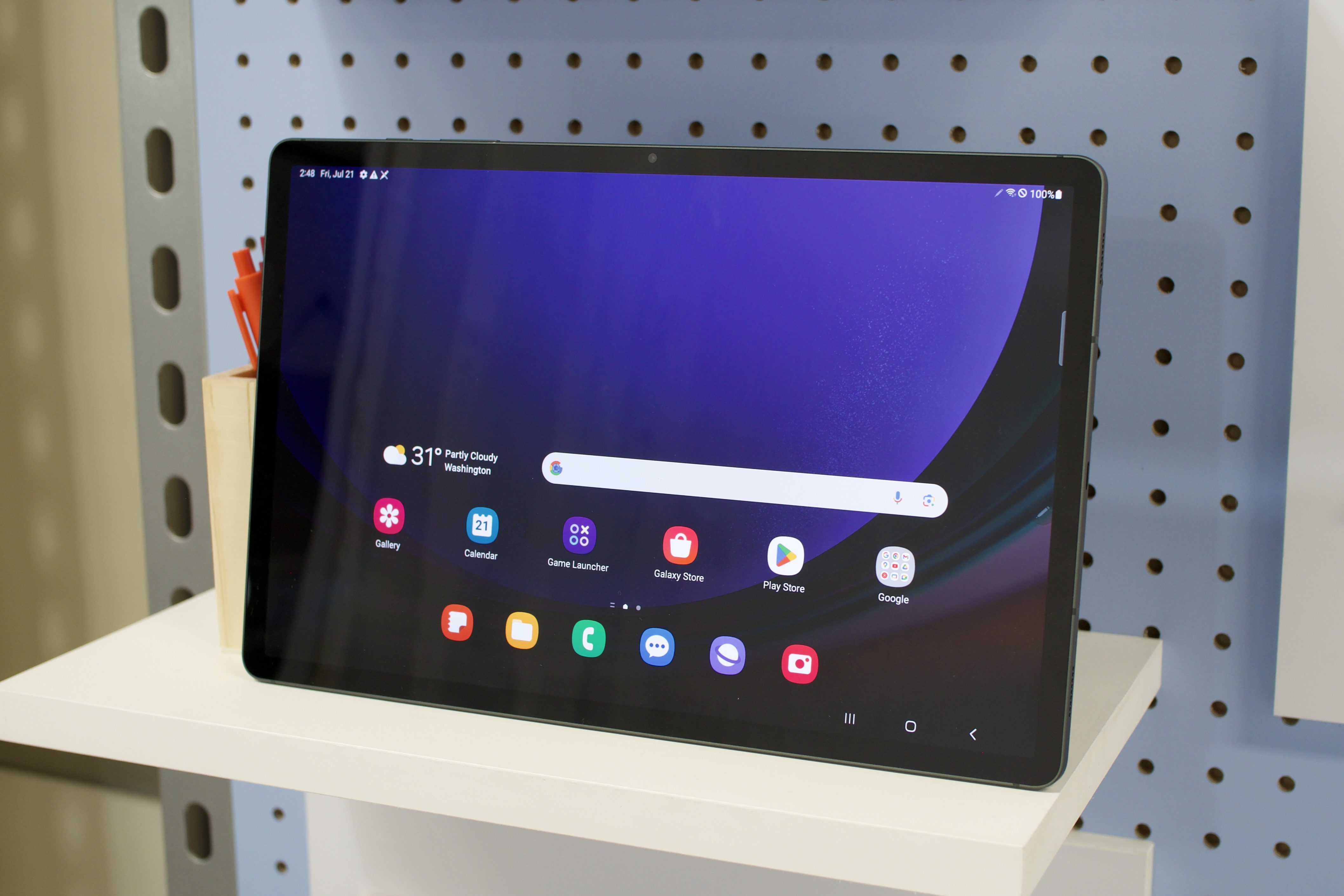 The Samsung Galaxy Tab S9 Plus sitting on a shelf.