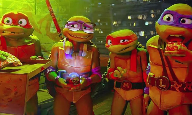 The Turtles eat pizza and look shocked in Teenage Mutant Ninja Turtles: Mutant Mayhem.