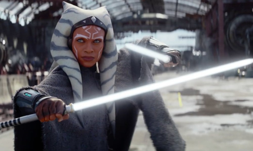 Rosario Dawson as Ahsoka dual-wielding her white lightsabers in the Disney+ series.