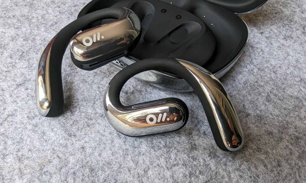 Oladance OWS Pro resting on open charging case.