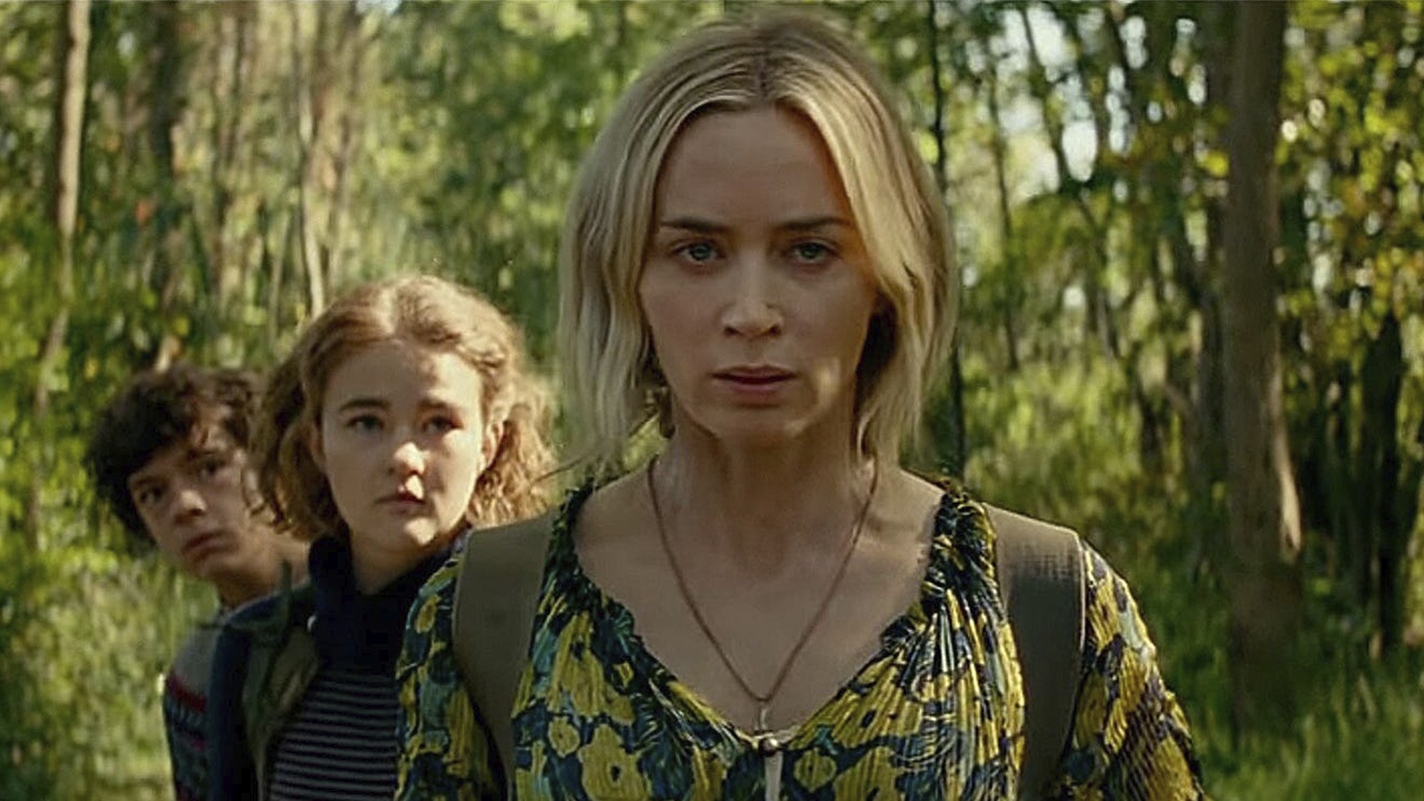 Evelyn from A Quiet Place Part II looking determined, her kids behind her.