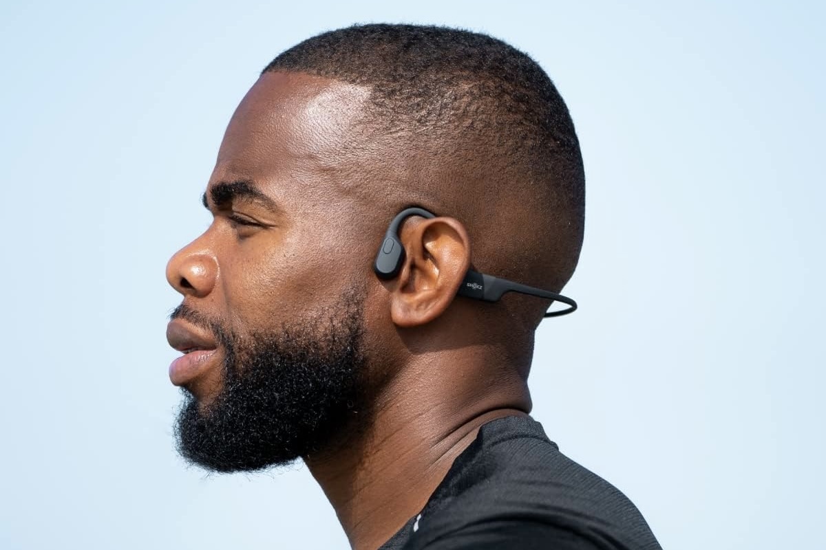 how do bone conduction headphones work person wearing shokz openrun 2