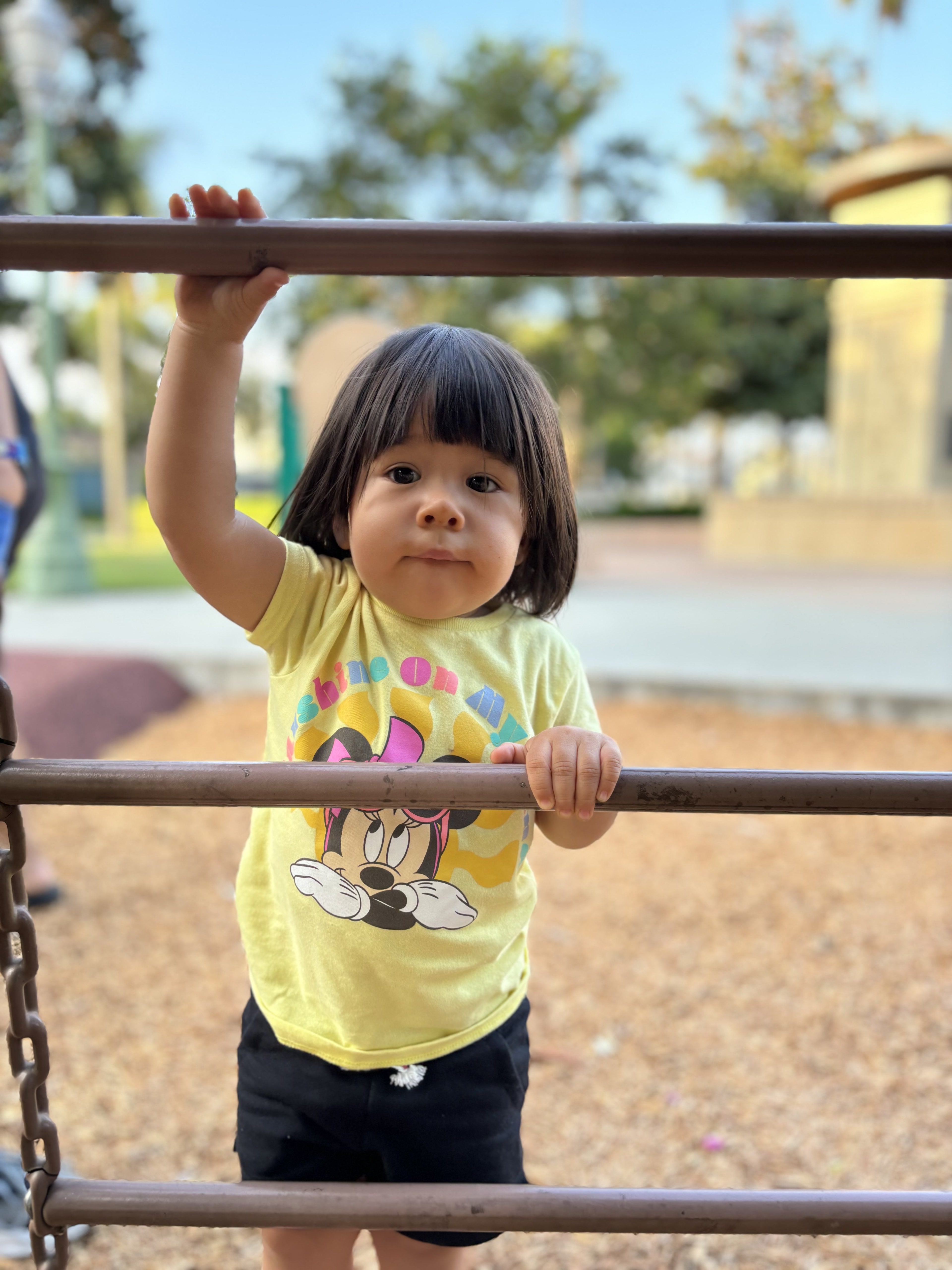 Toddler on playground taken with Auto Portrait on iPhone 15.