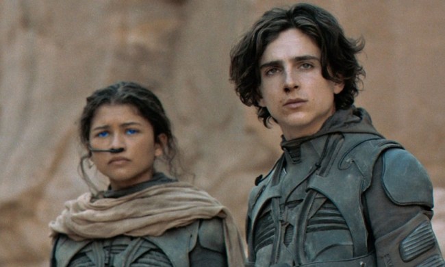 Zendaya and Timothée Chalamet as Chani and Paul looking to the distance in Dune.