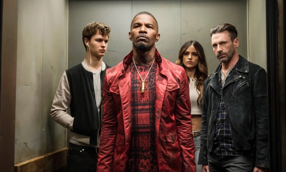 The cast of Baby Driver standing in an elevator.