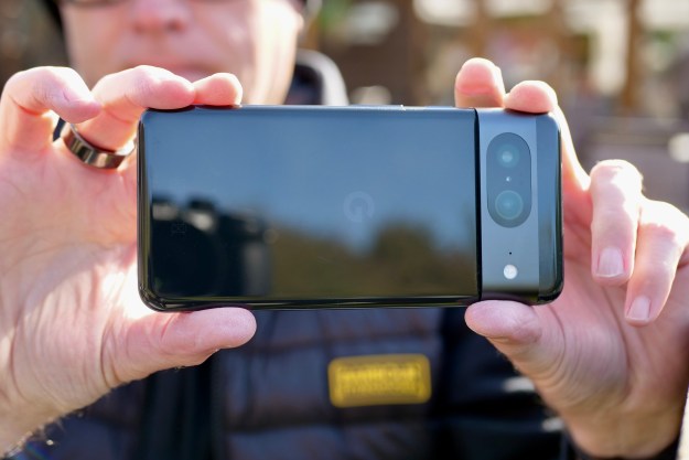 A person taking a photo with the Google Pixel 8.