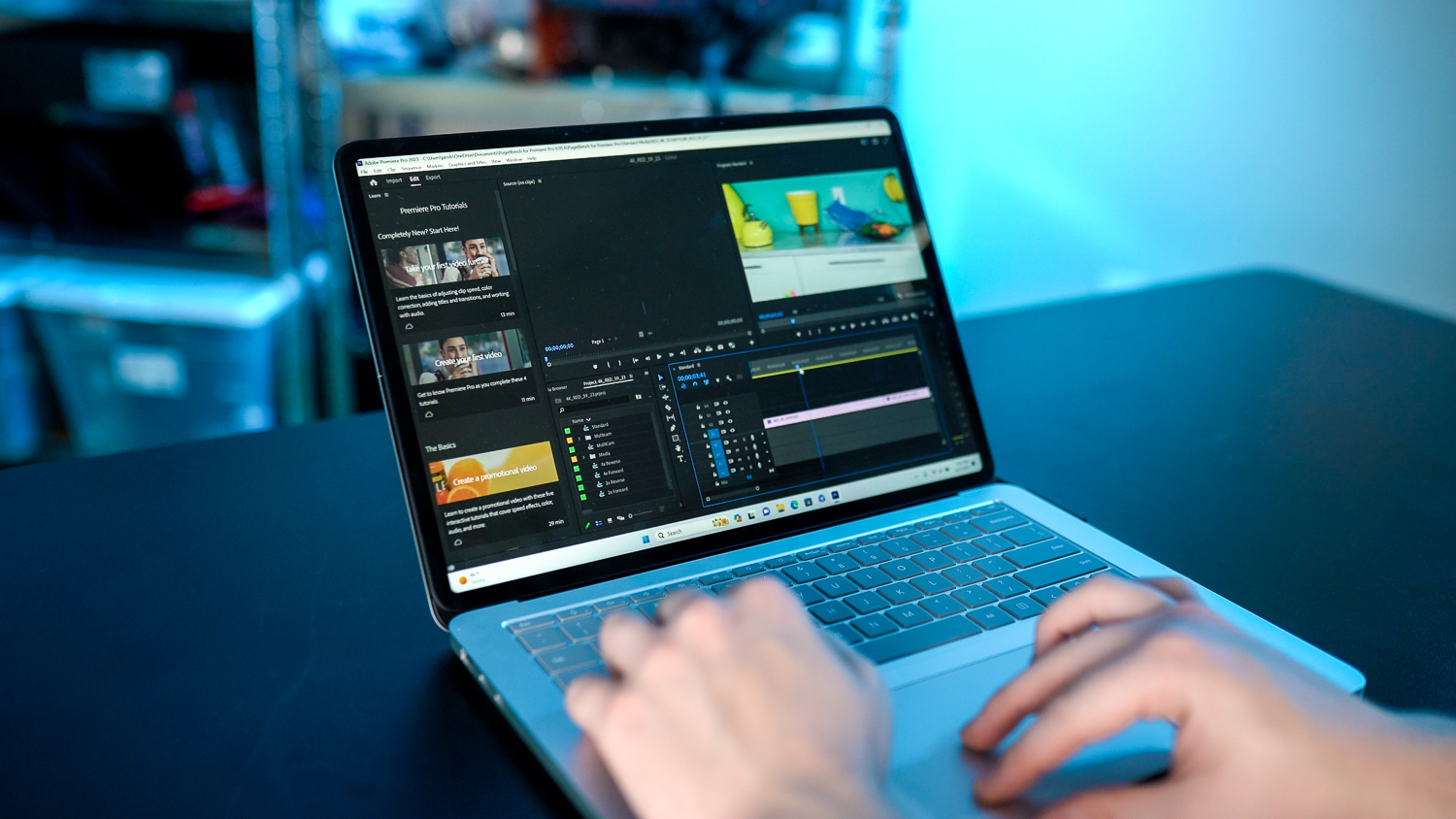 Someone using the Surface Laptop Studio 2 with Adobe Premiere Pro. 