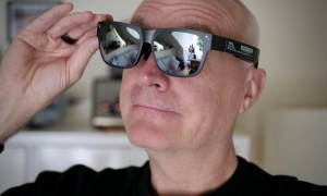 A person wearing the TCL RayNeo Nxtwear S XR glasses.