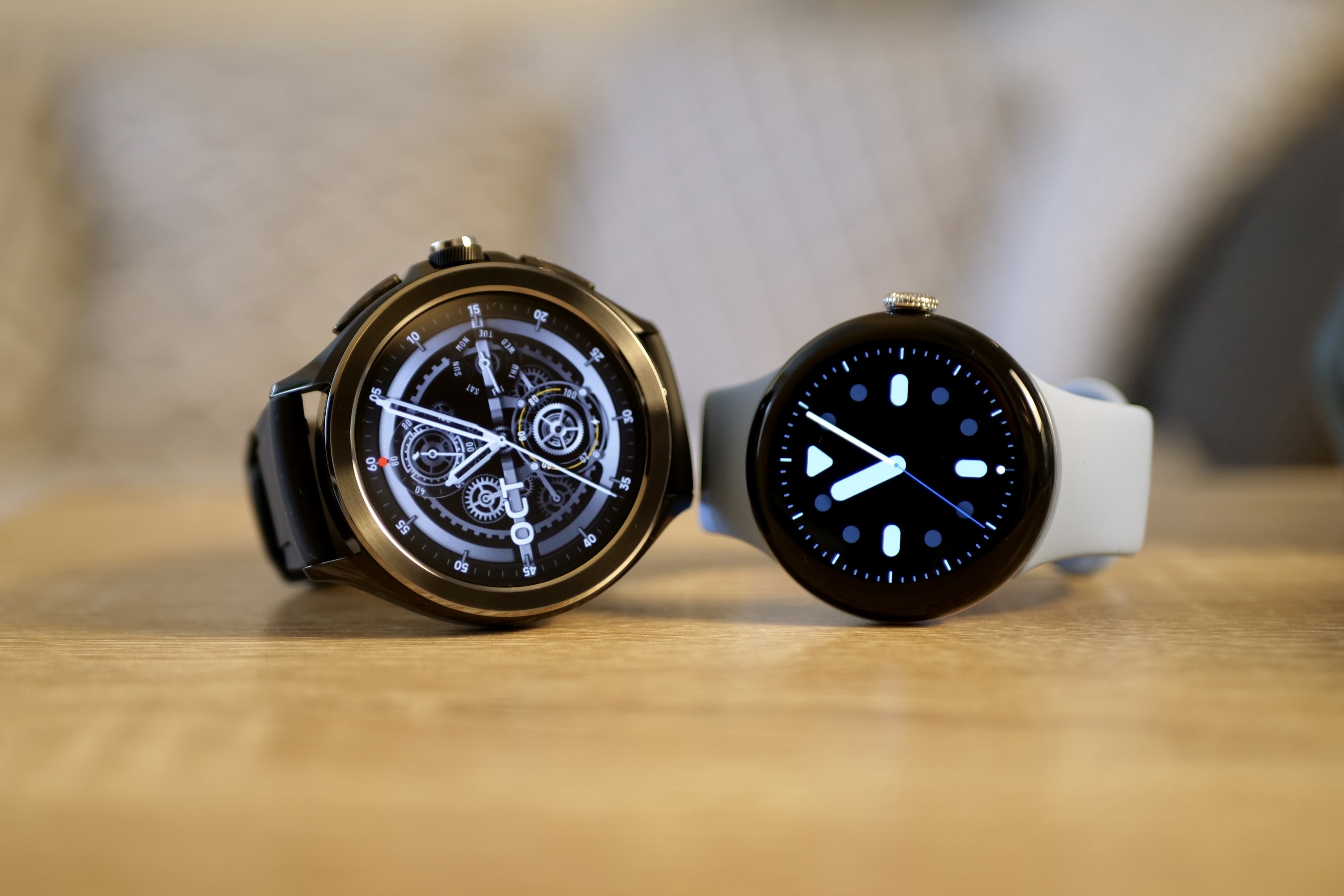 The Xiaomi Watch 2 Pro and the Pixel Watch 2, seen from the front.