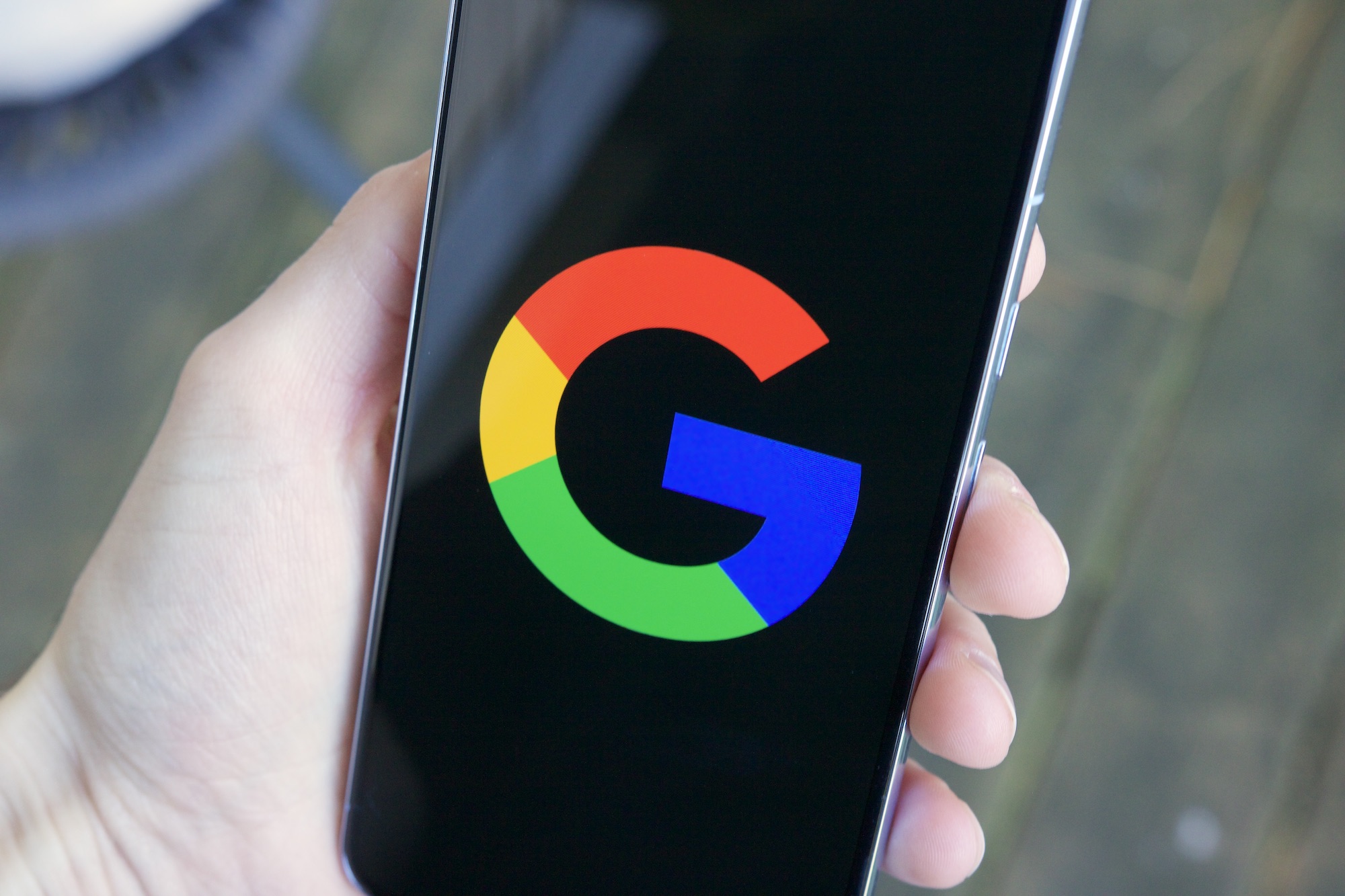 The Google "G" logo on an Android phone.