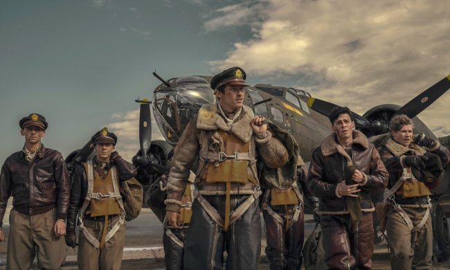 Callum Turner stands with a group of pilots in Masters of the Air.