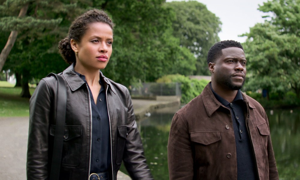 Gugu Mbatha-Raw and Kevin Hart walk together in Lift.