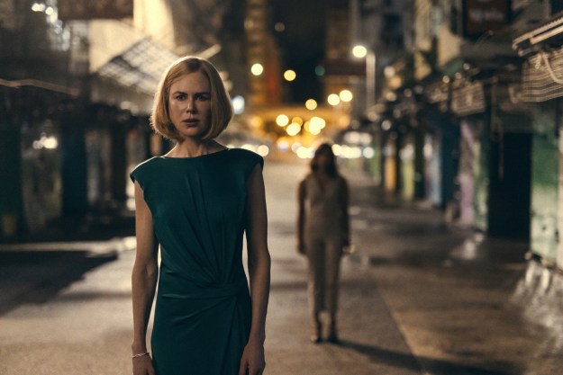 Margaret stands on a Hong Kong street at night in Expats.