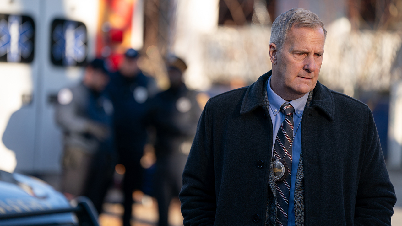 Jeff Daniels in a suit walking down the street in a scene from American Rust.