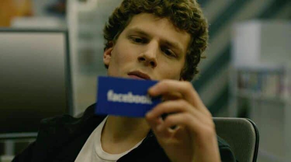 Mark holds a Facebook card in The Social Network.