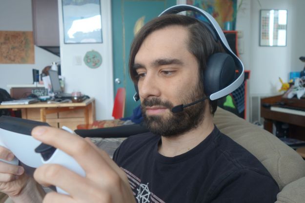 A man wears a Pulse Elite headset.