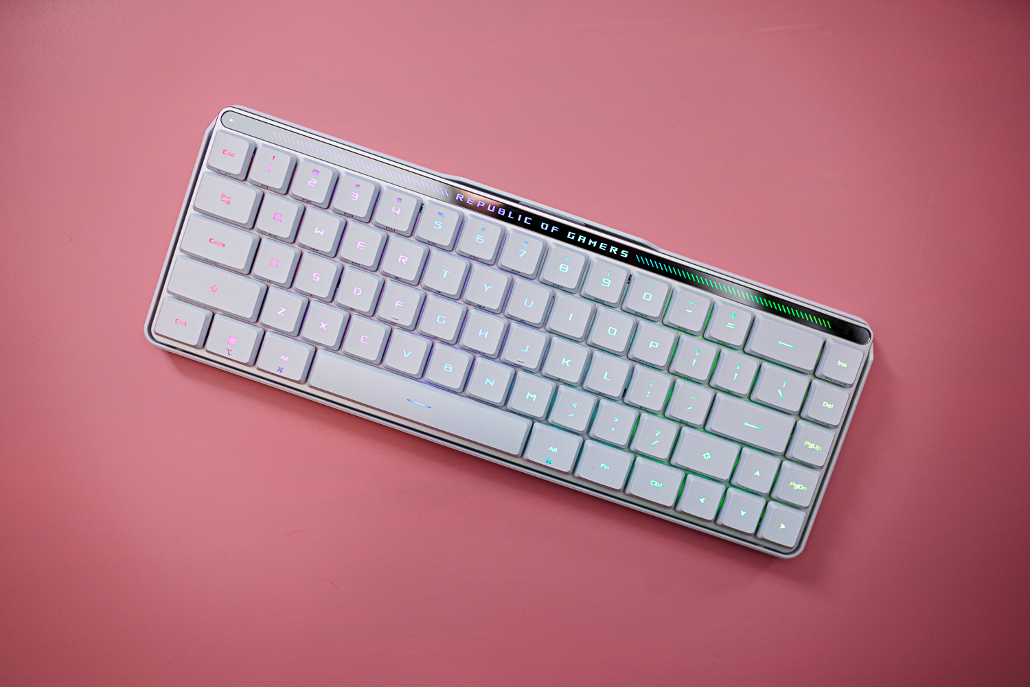 The Asus ROG Falchion RX LP keyboard on a pink background.