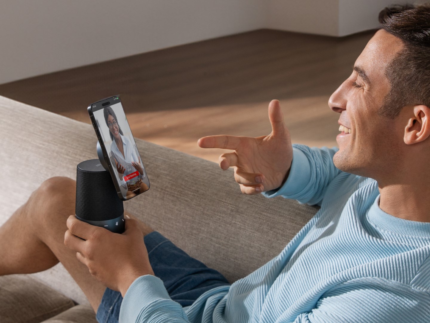 Man using AnkerWork S600 speakerphone