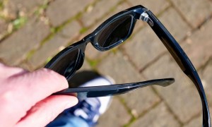 A person holding the Ray-Ban Meta smartglasses.