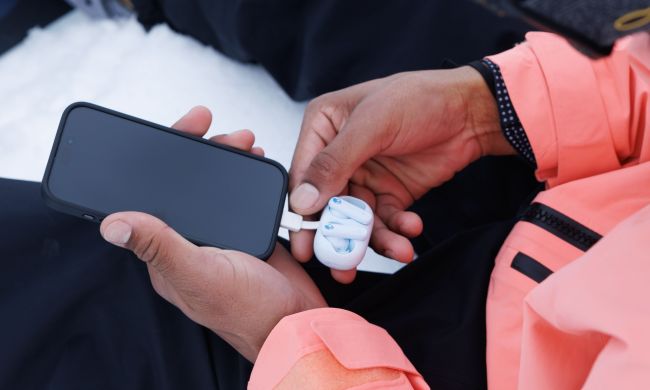 SkullCandy EcoBuds connected to a phone.