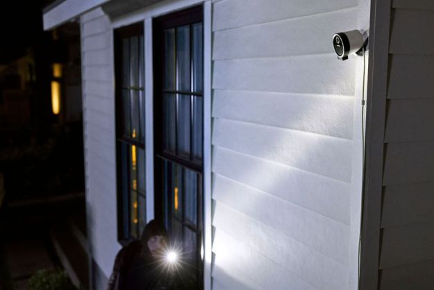 A SimpliSafe outdoor camera monitoring a stranger.